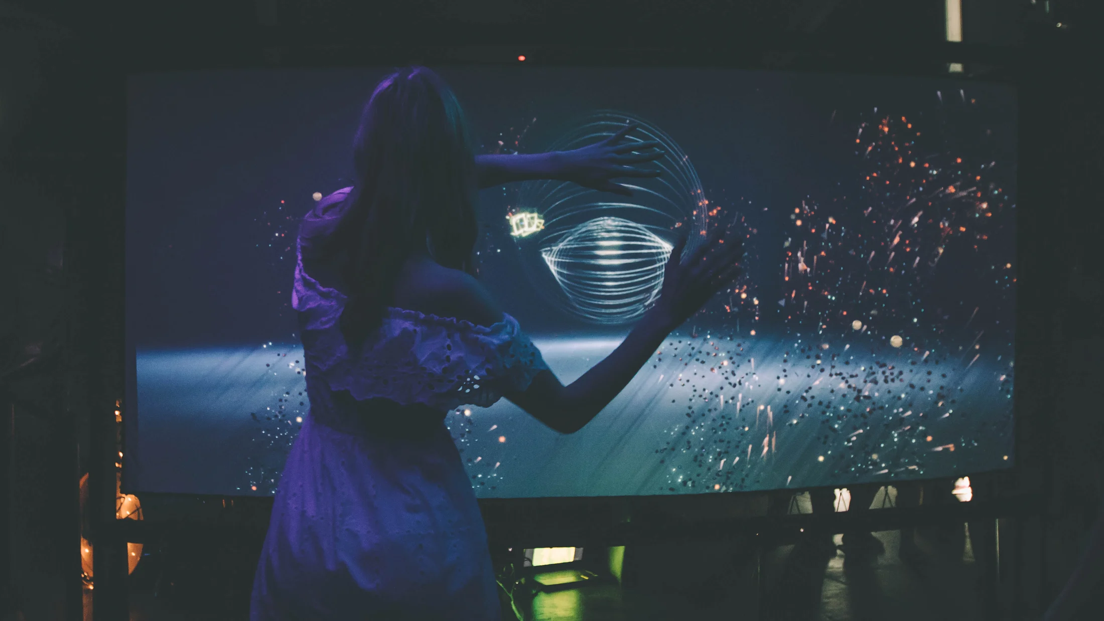 A visitor facing a digital portrait installation