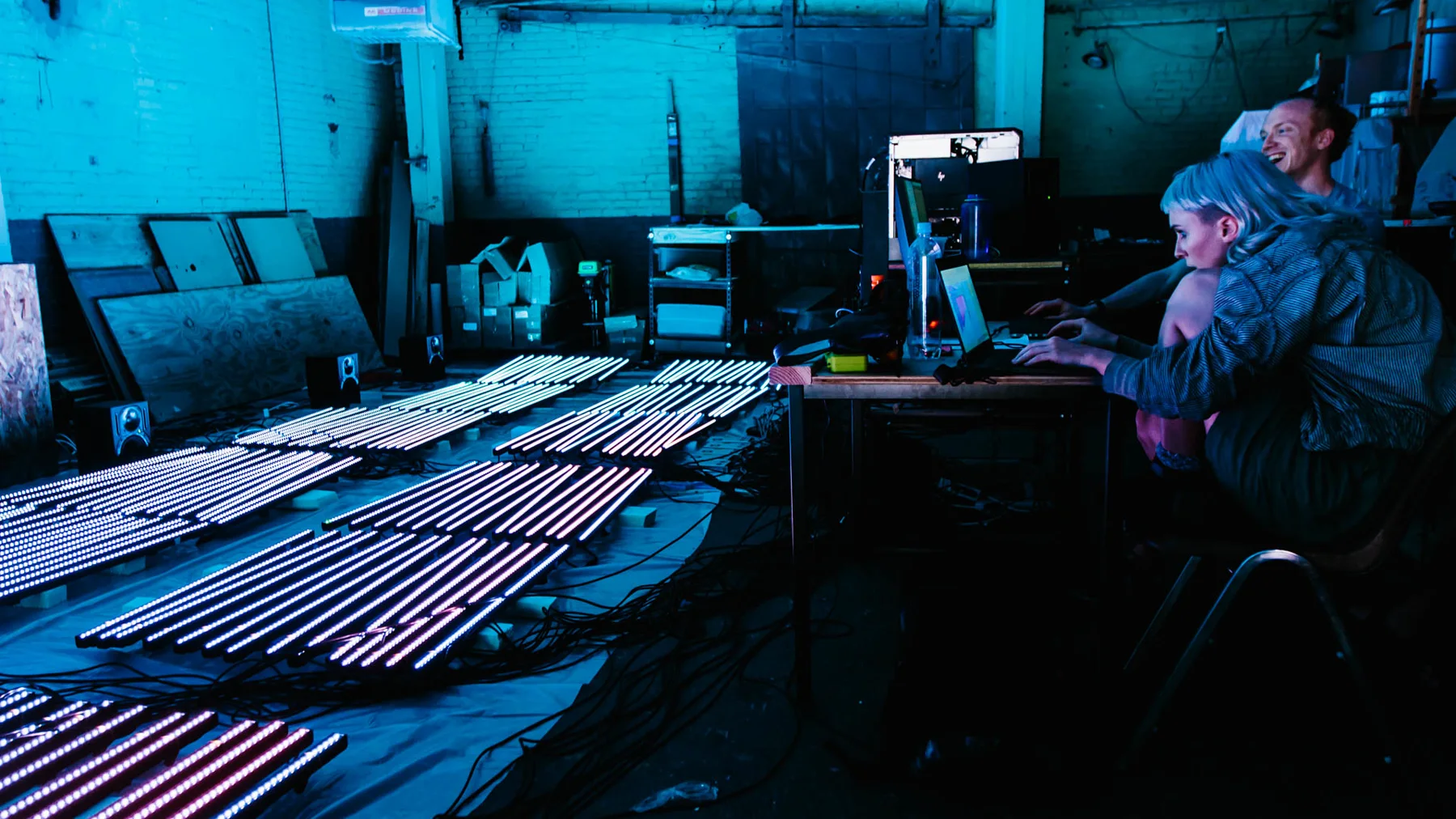 Magenta Field assembling LED elements on a workshop table